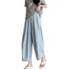 A casual summer look for women with light blue loose trousers paired with a grey top Item Picture